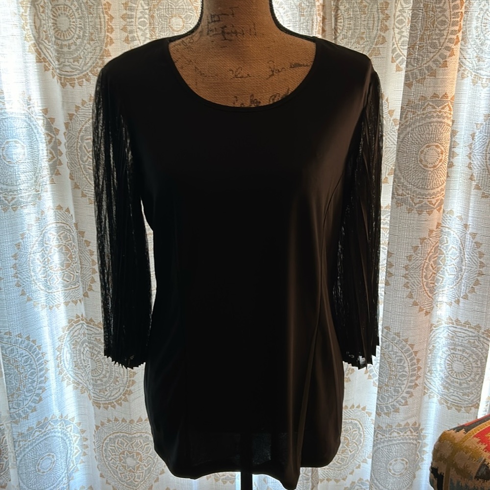 Black stretchy top with sheer sleeves.